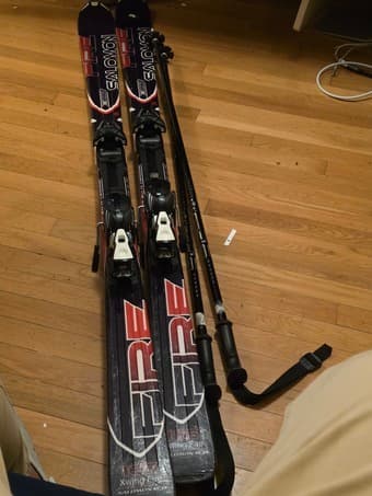 Pair of solomon skis and poles for sale 1